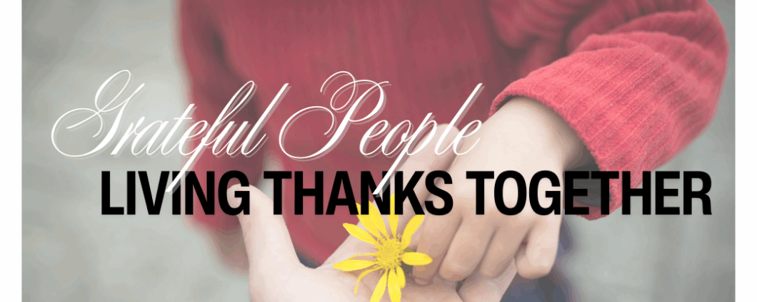 Grateful People: Living Thanks Together. A child places a flower into an adult's hand.