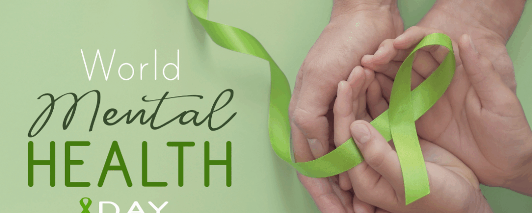 Text: World Mental Health Day. Image: two sets of hands cradling a light green awareness ribbon.