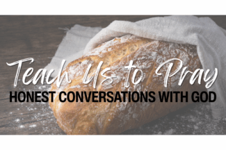 A freshly baked loaf of bread rests on a table. Text: Teach Us to Pray: Honest Conversations with God.